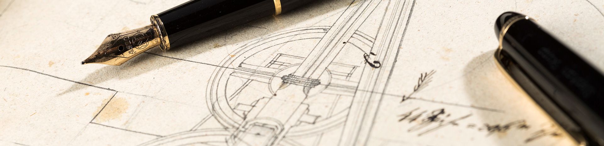 Pens laying on a technical drawing